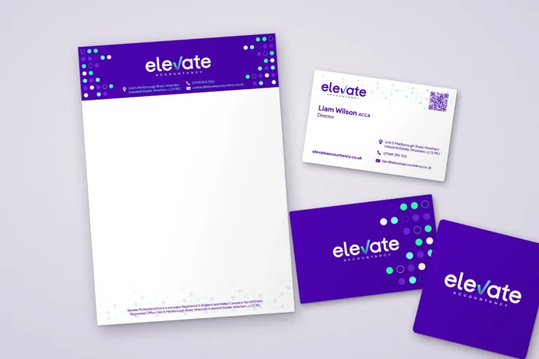 Elevate Accountancy letterhead, business cards and purple logo tile laid flat on a soft lilac surface